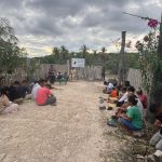 Warga Desa Bo'a Kecamatan Rote Barat, Kabupaten Rote Ndao, Provinsi Nusa Tenggara Timur (NTT), GEMAP ini dipimpin oleh Ketua Majelis Jemaat GMIT Solavide Bo'a, Pdt. Sherly Taka, S.Th., di depan portal palang PT. Bo'a Development. Masyarakat tampak khusyuk berdoa, sebagian beralas tikar, sebagian lagi langsung di atas jalan sirtu PNPM MP 2013. (Foto: Exel A. Lani).